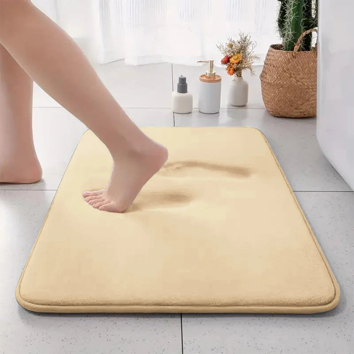 Beige flannel absorbent bathroom floor mat, soft and durable.