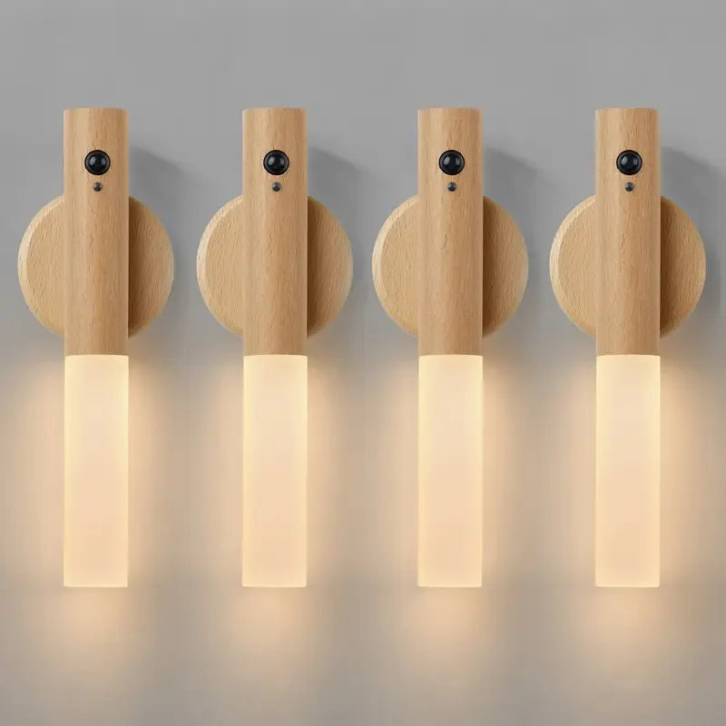 Four wooden wall sconces with light emitting from the bottom on a gray background