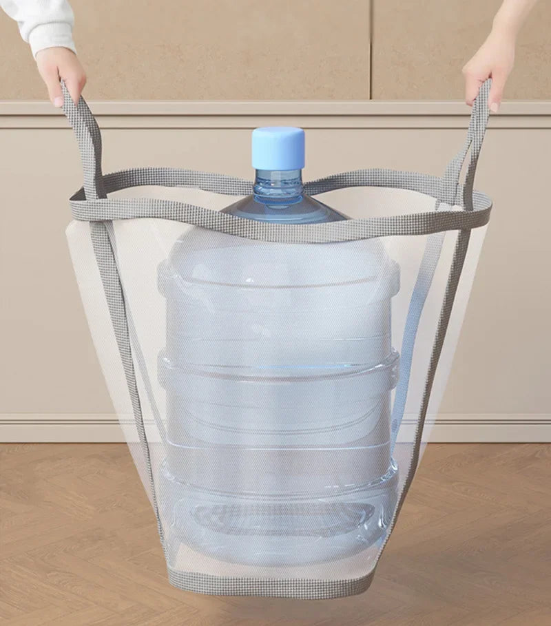 Grey mesh laundry basket placed near washing machine