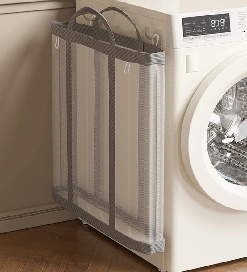 Mesh laundry basket in front of a washing machine