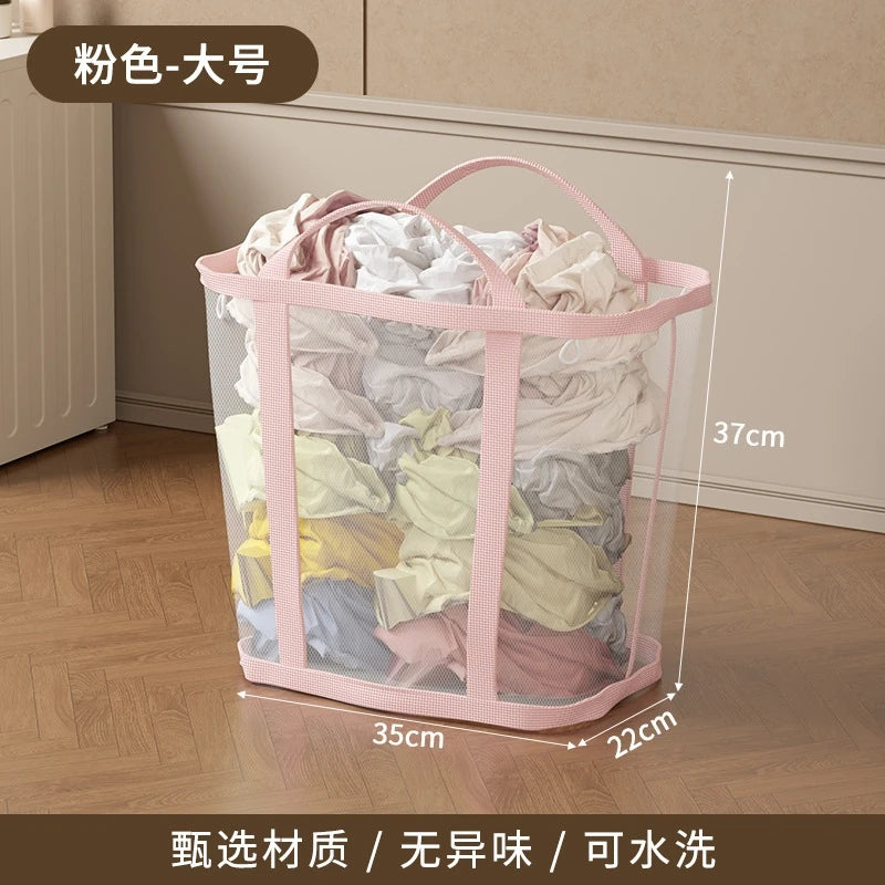 Pink mesh laundry basket filled with clothes on a wooden floor, with dimensions indicated.