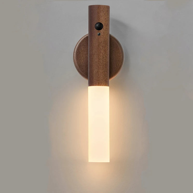 Wooden wall sconce with a light fixture on a plain background