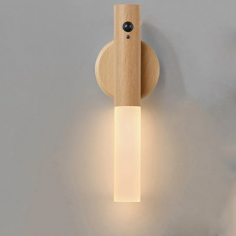 Wooden wall lamp with a cylindrical design on a gray background