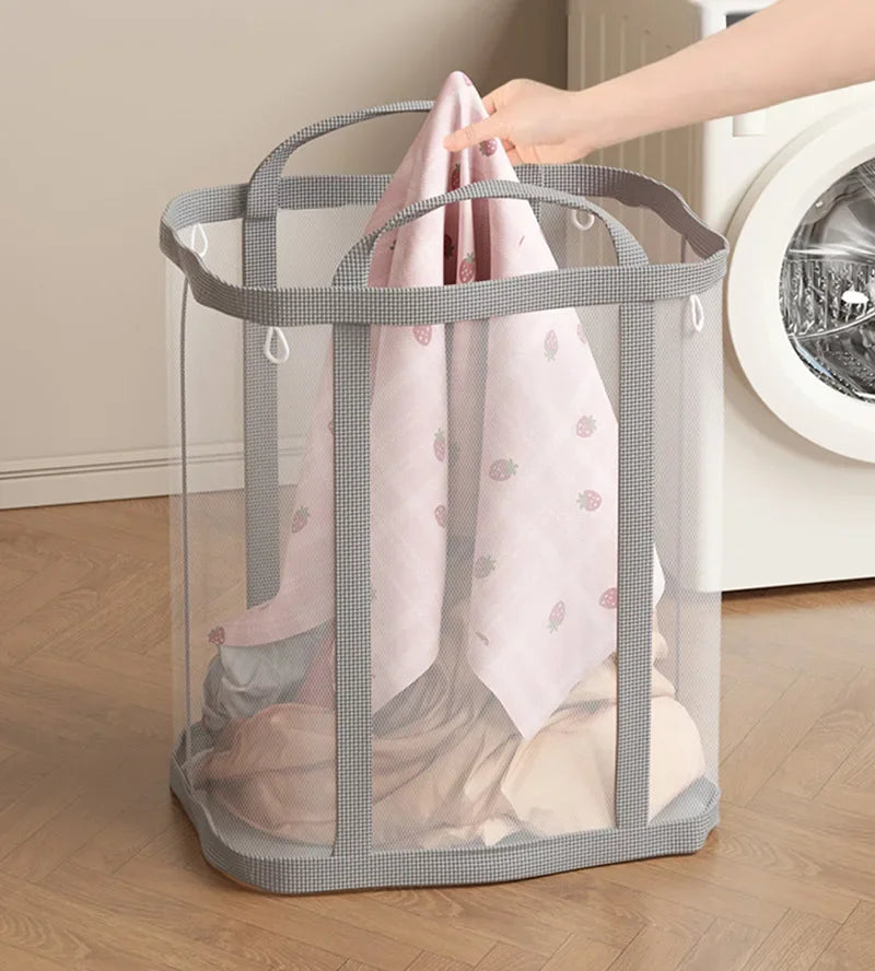 Pink mesh laundry basket with handles for easy carrying
