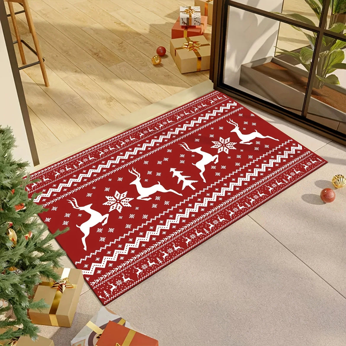 Red Christmas rug with reindeer and snowflake pattern placed in living room near Christmas tree and gifts.