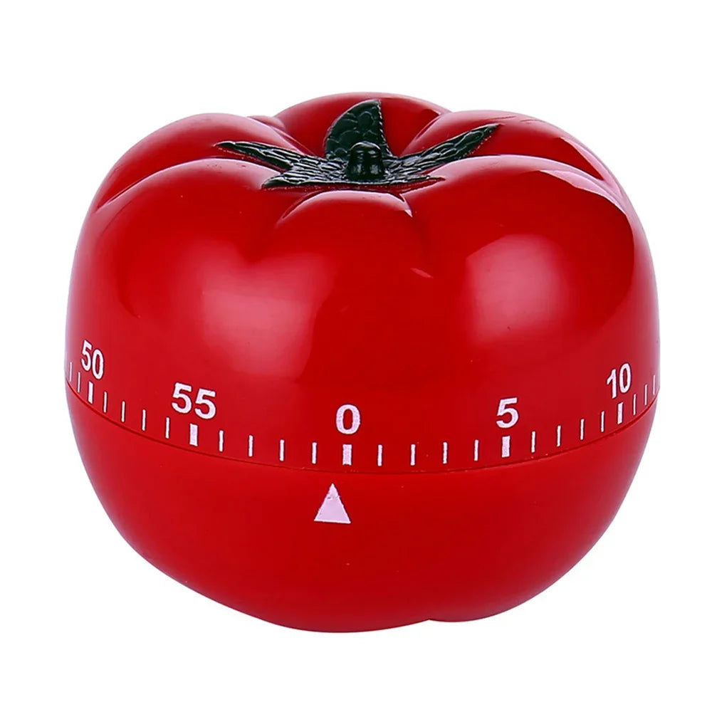 Red tomato-shaped kitchen timer on a white background
