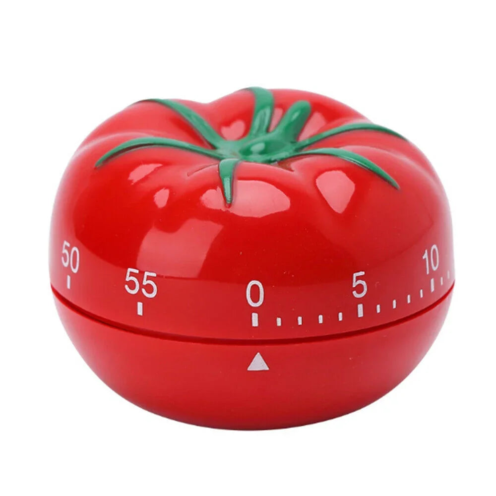 Red tomato-shaped mechanical kitchen timer for cooking