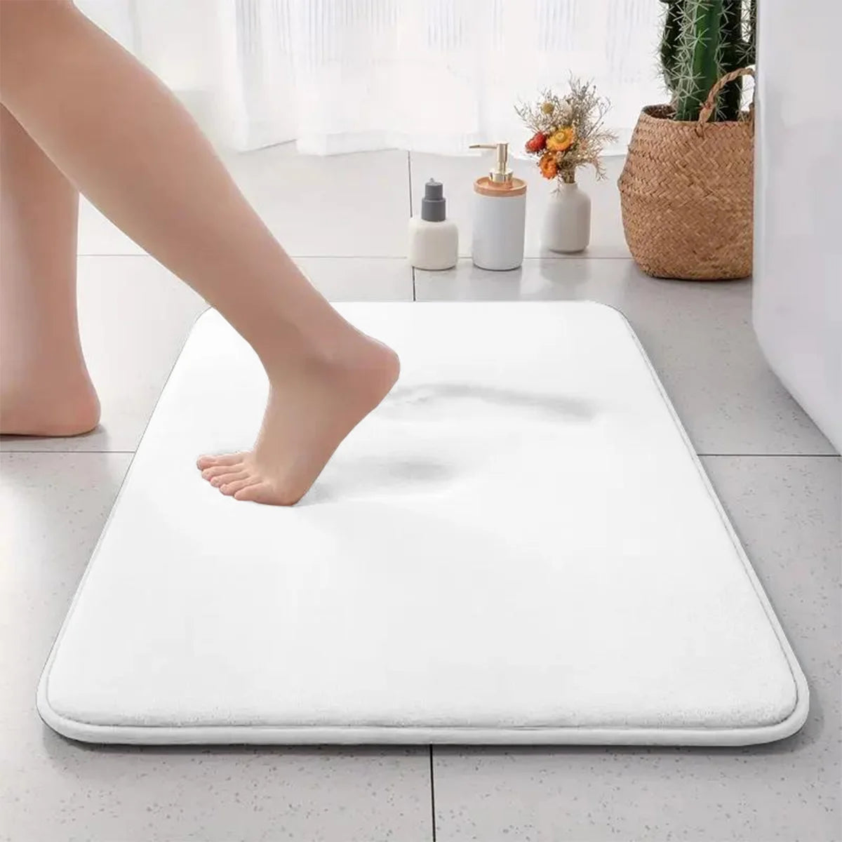 White flannel bathroom mat with anti-slip bottom and absorbent surface.