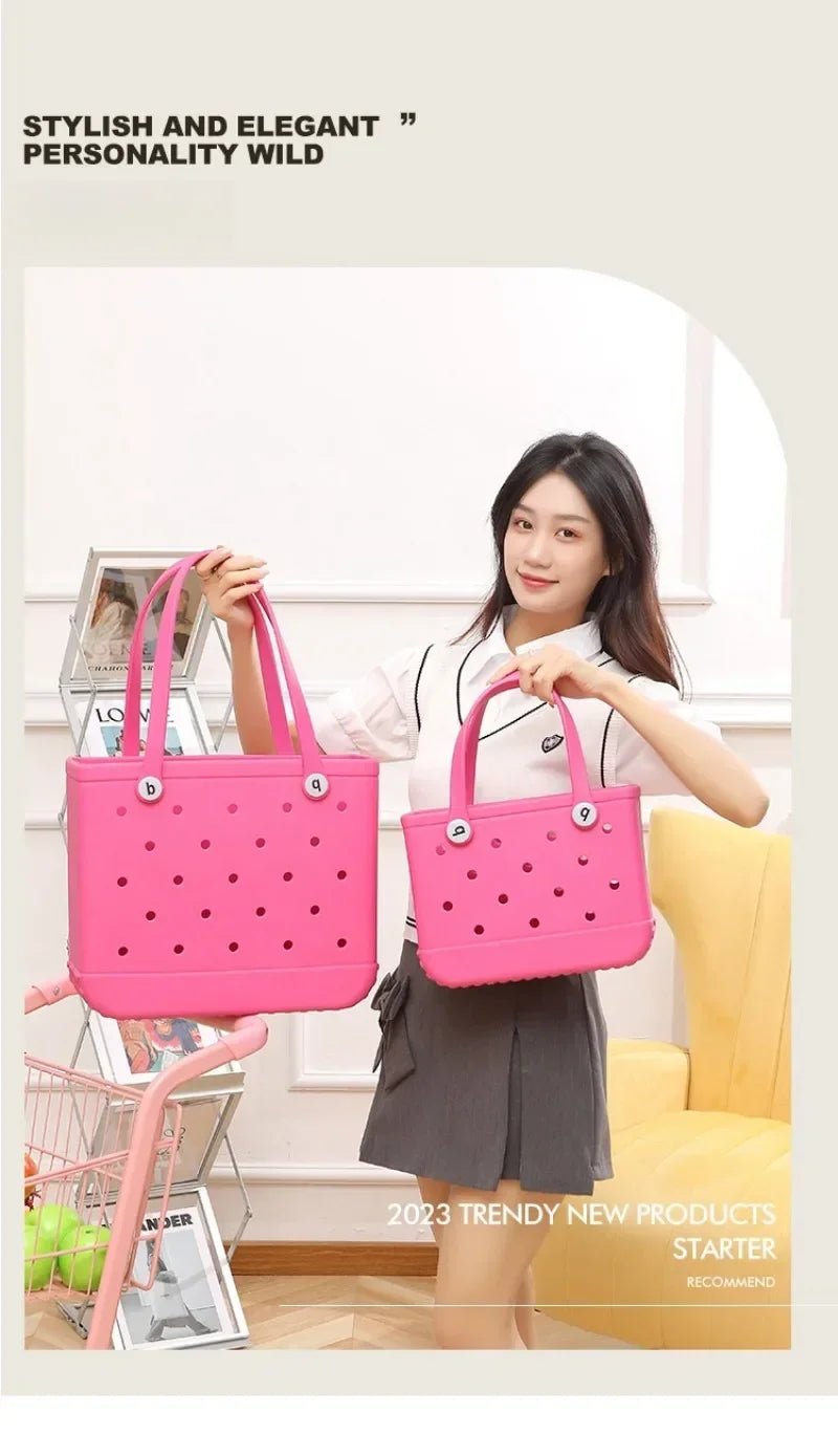 Woman holding two pink handbags with a minimal background