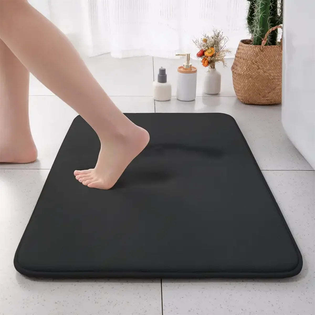 Dark gray flannel bathroom mat with non-slip and absorbent surface.