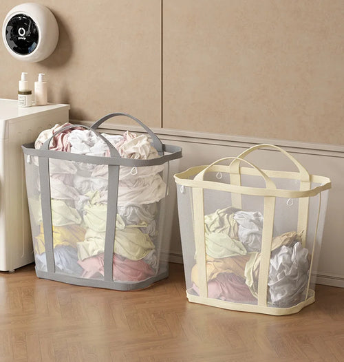 Foldable mesh laundry basket with clothes near washing machine